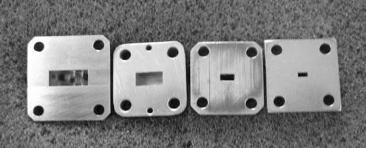 MICROWAVE AND MILLIMETRE WAVE SENSORS FOR CRACK DETECTION 697 Fig. 1 The front view of the flanges and apertures of standard rectangular waveguides at (from left to right) K-, Ka-, V- and W- band.