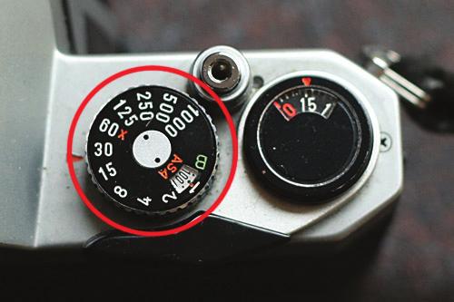 A fast shutter speed opens the shutter for a short amount of time allowing less light to hit