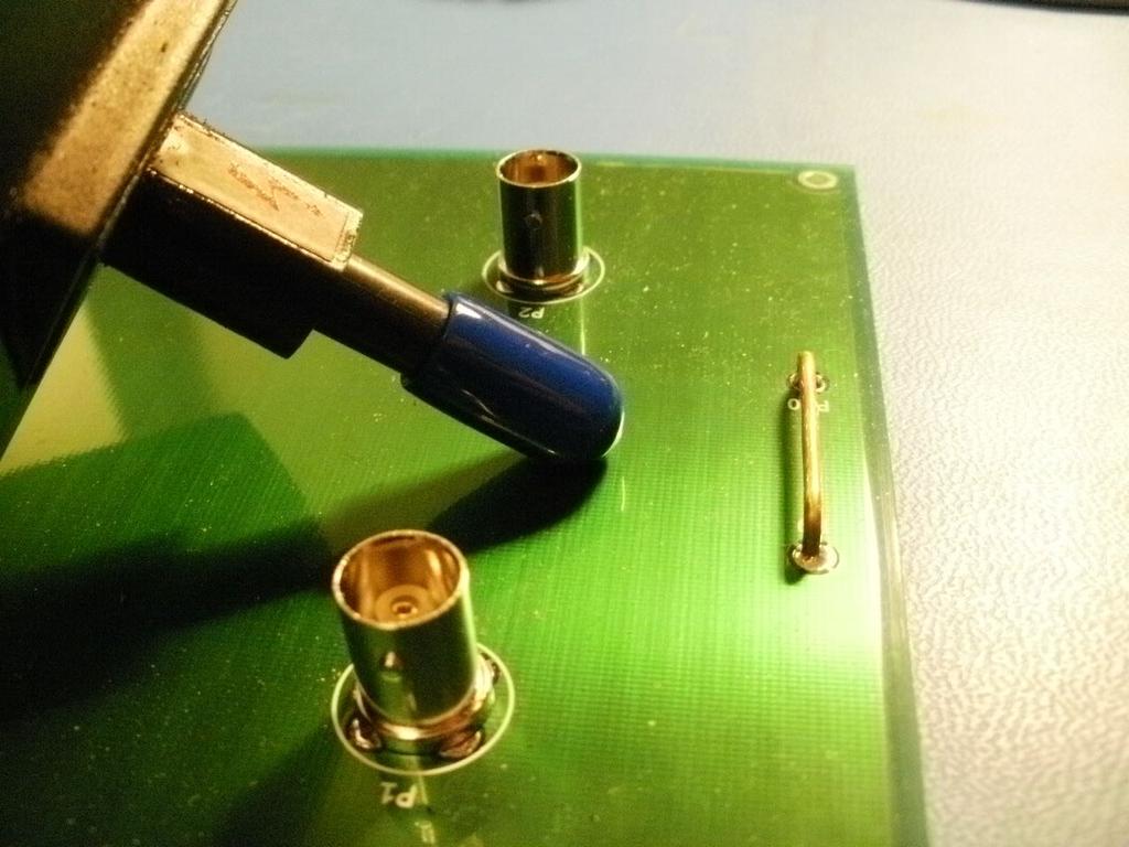 the copper tape. As before, one must insure the tip of the ESD simulator is allowed to bleed off charge before the next simulator discharge. Figure 1. Coupling ESD energy to a PCB. Figure 2.