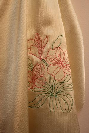 This sample features a vintage Alstroemeria design. The design is very simple with large open areas, and simple running stitches. There is no shading or highlighting, making this a very simple design.