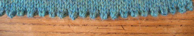 You will need to knit into each stitch along the cast on edge; take a look at your edge and decide which part of the stitch you will knit into.