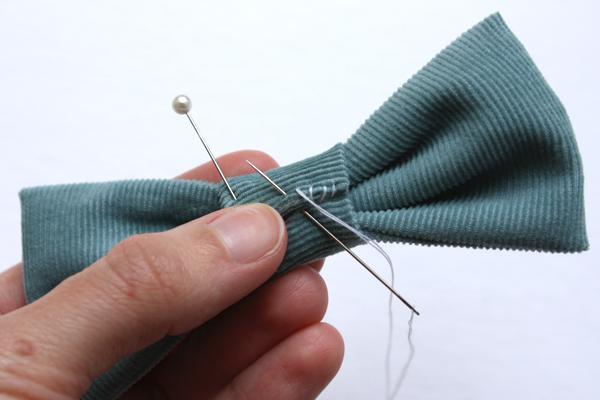 - With a hand needle and thread, stitch the binding