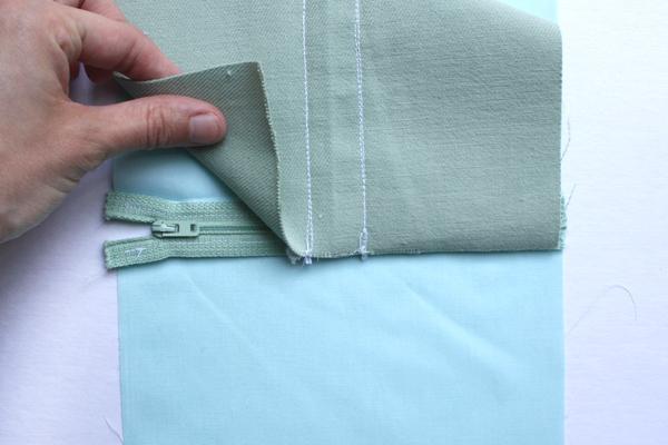) - Lay your lining/zipper piece down so the zipper is facing up.