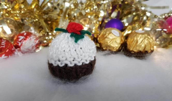 Knit a Pud Help St Clare by making a knitted Christmas Pudding to fit over a Ferrero Rocher or a Lindt truffle.