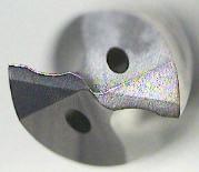 The first is the S-type chisel according to US Patent 6,739,809 (Kennametal, Bill Shafer) that reduces the axial (thrust) force and thus reduces burr formation.