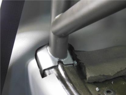 Feed one panel at a time under the Roll Bar main hoop in the center, then work them forward between the Roll Bar and B-pillar.