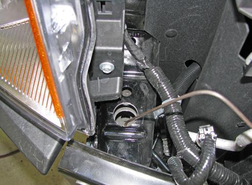 Reattach the coolant line to the back holes using 1/4-20 x 1/2 hex bolts and