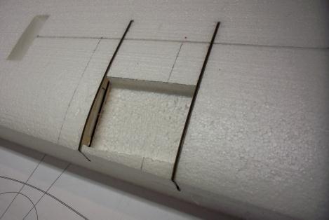 Push them down into the slot far enough to mark out the plywood cut out. Use a dremel tool for cutting out the foam.