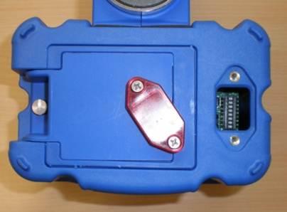 The dipswitches are accessed through the USB/IR cover on the bottom of the PGT transmitter (see Figure 7).