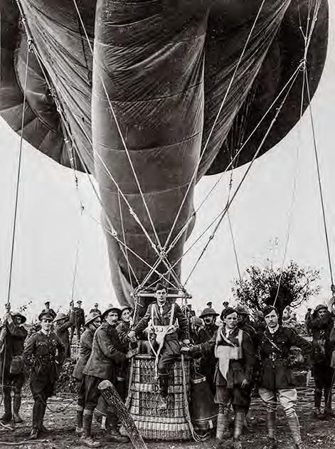 IWM Photograph Archive, File No. E (AUS) 1175 An observer, wearing a parachute, disembarks from the basket of an Australian observation balloon, Ypres Salient, Belgium, October 23, 1917.