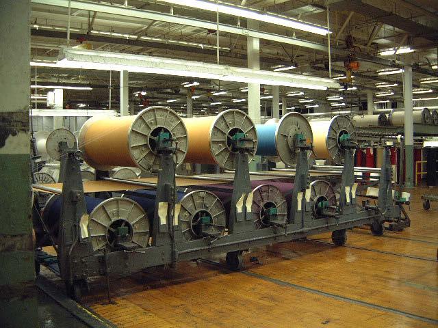 Figure 6. Slasher creel loaded with beam-dyed yarns for a warp-striped fabric From the creel, the yarns flow through the size box, where where the liquid size solution is applied to the yarn.