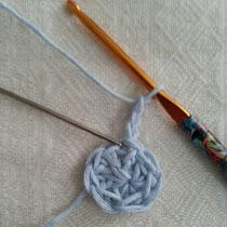 Now, make three chain stitches to begin the next round. This length of chains also counts as your first treble crochet stitch in this round.