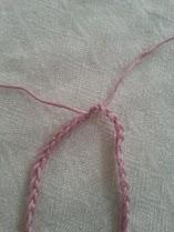 You then want to make a knot at the very end of the string.