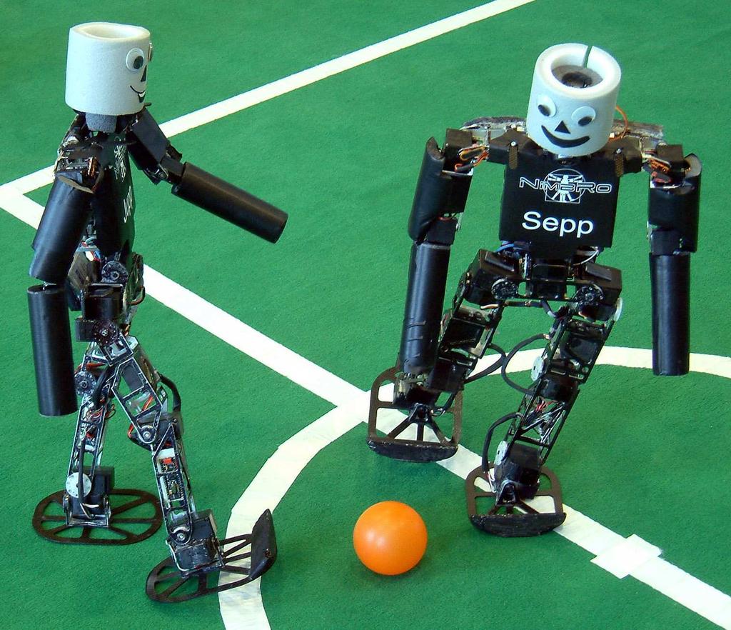 2 S. Behnke, M. Schreiber, J. Stückler, H. Strasdat, and M. Bennewitz Fig.1. NimbRo KidSize robots Jupp and Sepp playing soccer. proportions.
