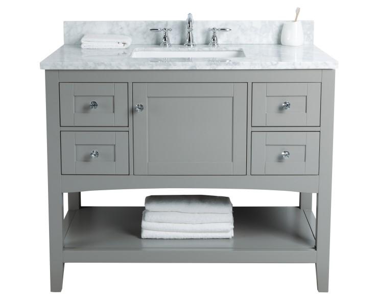 The cottage style vanity is constructed of solid wood with clean and crisp lines and a beautifully arched roman