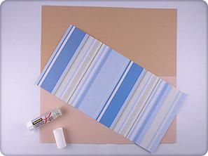 Difficulty Medium Materials Blue striped 12 x12 inch scrapbooking paper 3 sheets of different colored beige cardstock to coordinate with the stripes (one for mounting) 1 sheet of blue cardstock 1
