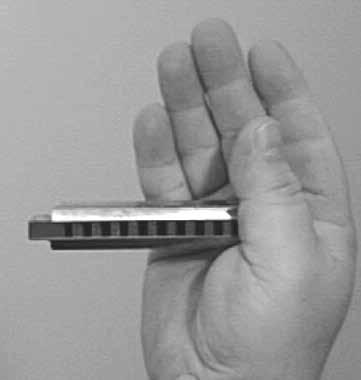 HOLDING THE HARMONICA There are several accepted ways to hold the