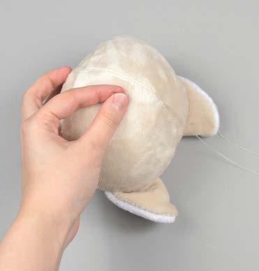 Once the plush is stuffed, make sure the seam allowances in the opening are tucked inside and prepare to ladder