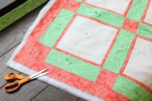 Now that your batting is all set to go, cut out a big piece that is larger than your quilt top.