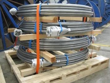 Picture 7: Coiled rope assemblies on wooden beams and on a wooden pallet In the