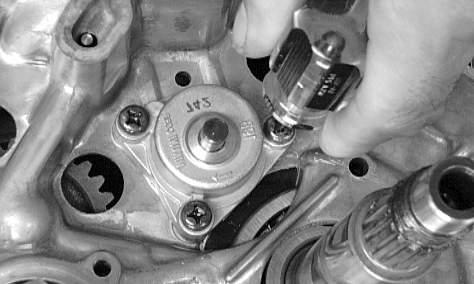 -104 CC49D 16. Remove the Phillips-head screws securing the oil pump; then remove the pump. Fig.