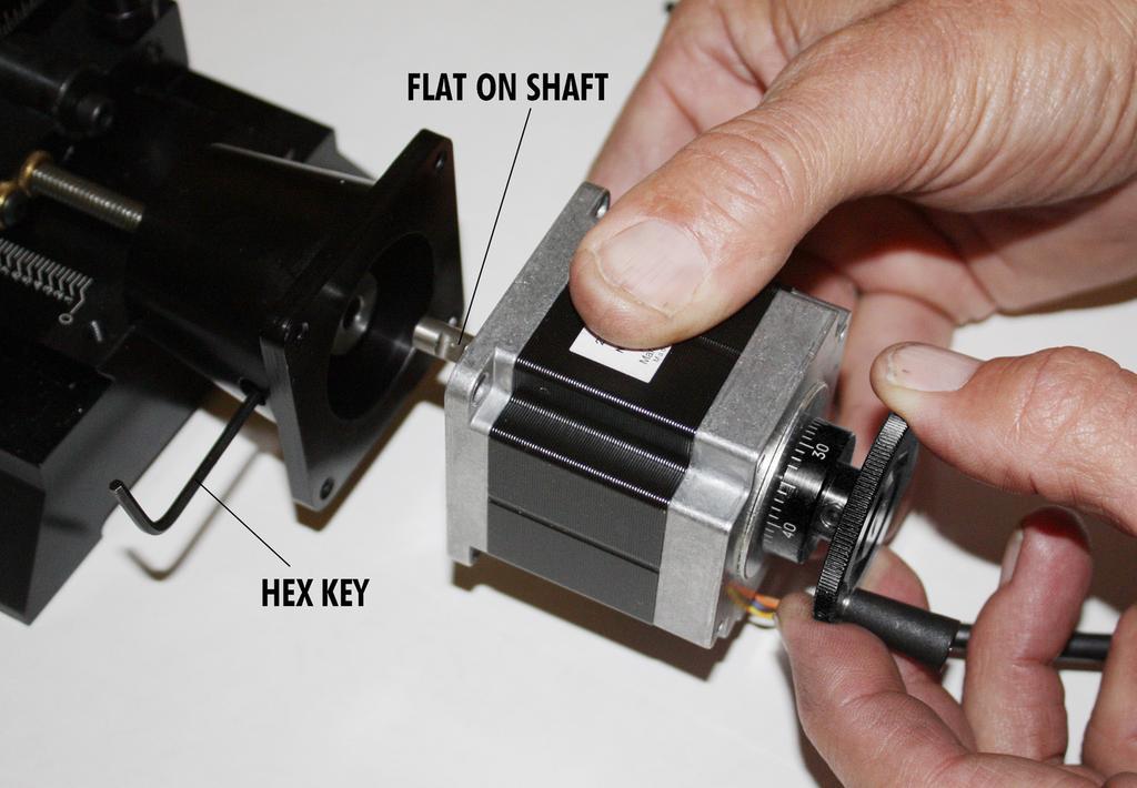 Fig 5. Gently rotate handwheel back and forth while sliding shaft into coupler. (When removing a motor from the unit, reverse this procedure to keep from breaking the coupling.) e.