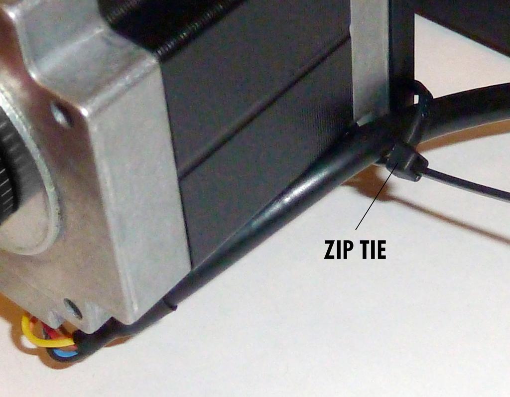Fig. 7 The motor cable is secured in 4th screw hole with a zip tie to relieve stress on the plastic wire coupling. 9.