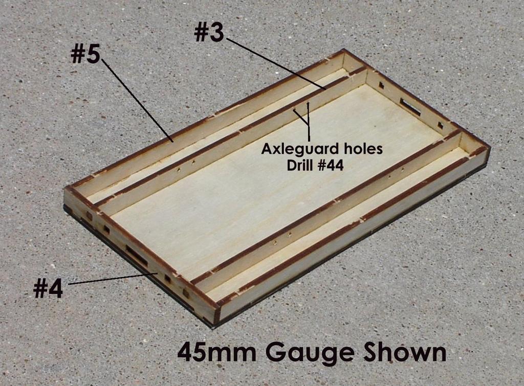 Assembly Instructions 1.) Begin construction by locating the notched 1/16 ply sub floor (part #1) and 1/16 floor (with the door guides) (part #2).
