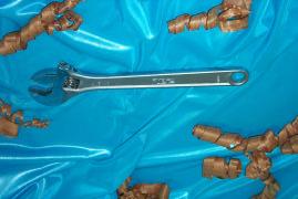 Adjustable Spanner 8 This is a spanner that consists of a movable jaw that can be adjusted to