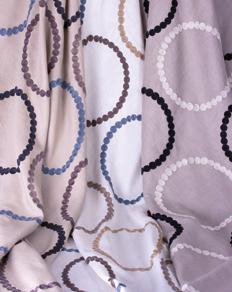 COCO 3534/01 03 65% Linen 35% Polyester 3 colorways This creative linen-based fabric with large embroidered roundels strung in circles will add a special touch to any corner of your room.