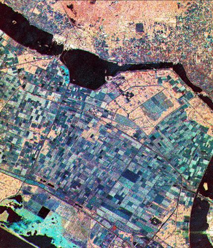 Agriculture, SIR-C/XSAR Image This is a three-frequency, false color, SIR-C/X SAR image (L band total power - red, C band total power - green, and X band vv - blue) of Flevoland, The Netherlands,