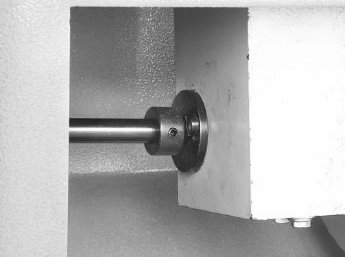 On left side of jointer (facing front of machine), remove (3) Phillips head screws that secure bearing support plate to cabinet (see Figure 3).