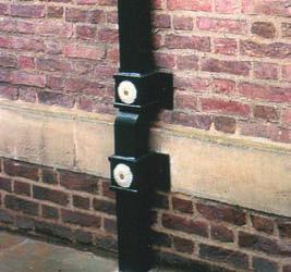 100mm lengths. These are secured in wooden plugs fitted in the brickwork/masonry background.