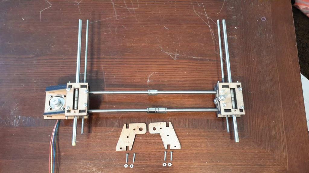 . Insert assembly into the rod holes on Z-motor mounts (G).. Attach left and right Z-axis rod holders (I). 9.