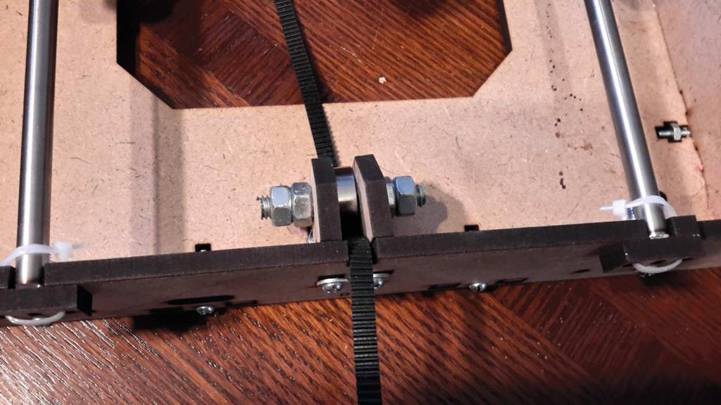 3. Attach one end of the belt to the Y-carriage bolt on (P) by folding over and zip tying in place. Make the excess as small as possible to allow as much movement as possible. 4.