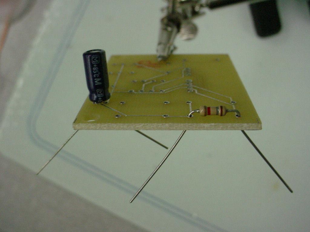 on the top side of board Check the alignment of polarized components Components should be nearly flush