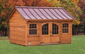 Optional: 5' fiberglass door stained old heritage mahogany with carriage windows and long hinges, carriage 12-lite windows and tan stucco on balance of front 10'x12' Quaker Cape Cedar Deluxe Cedar