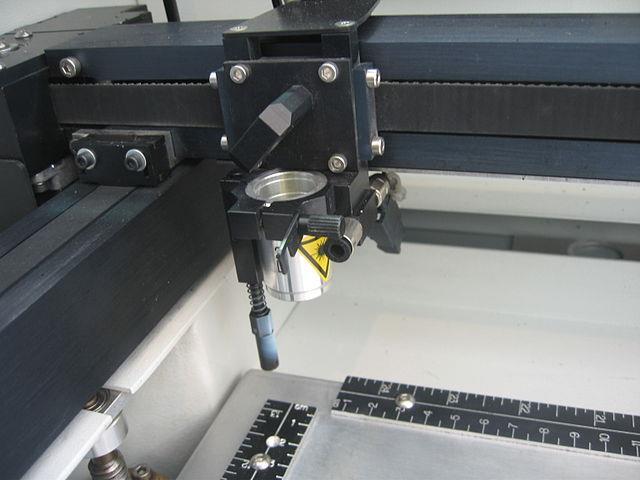 7 In the beginning, the so-called X-Y table is using the XY-Plotter control part to regulate the movement of laser beam. The figure 1.2 is a zoom view of an X-Y table. Figure 1.