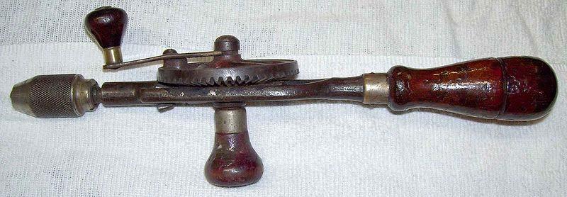 An old hand drill or "eggbeater" drill.