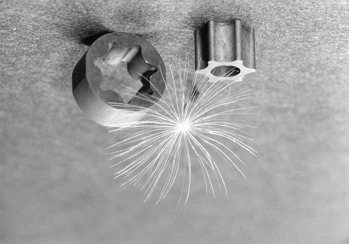 Grinding Figure 2 shows a test structure ground into hardened steel (X 155 CrVMo 1 2 1). The tool used is a CBN micro grinding wheel B15 (hard resin bond), cutting width 100 µm [13].