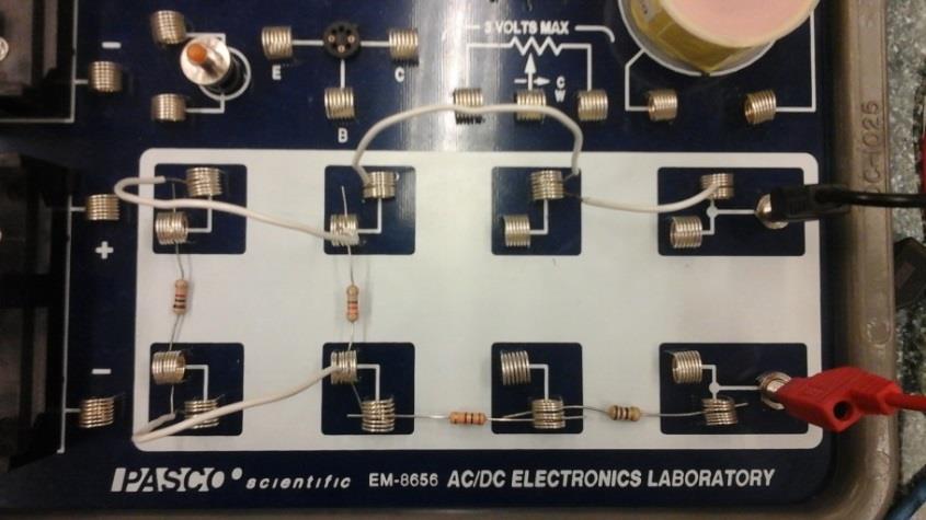6. Using another small wire provided in the AC/DC Electronic Laboratory connect the current sensor directly to the 10Ω such that the current sensor is also in series with the resistor. 7.