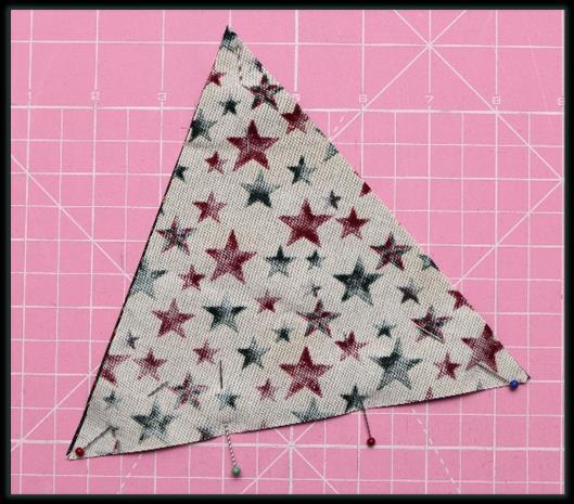 You will need ten cream triangles and ten green triangles to make the Christmas tree, and one green triangle for the base of the tree. 3.