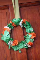 Staple all flowers and shamrocks onto cardboard wreath and hang! This craft has a lot of steps to it.