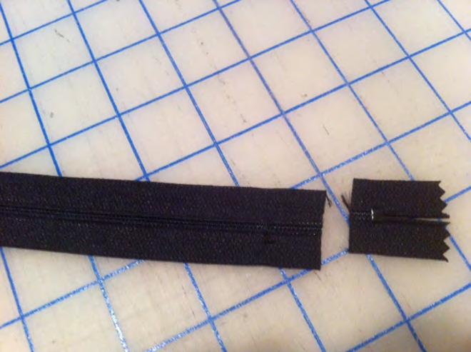 Step 22. Shorten the 18 zipper to 17 by stitching 1 in from the stop, across the teeth several times to create a new stop. Trim zipper 1/2 in from original stop. Step 23.