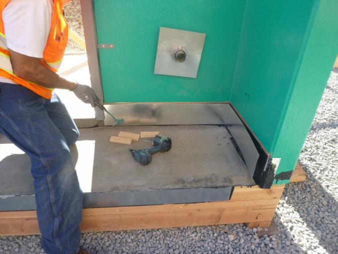 Install UV metal counter flashing with hemmed edge on bottom of leg and fasten with