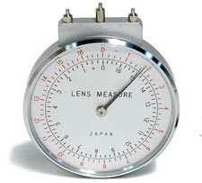 A lens measure has three points of contact which are placed on the lens surface to measure its curve.