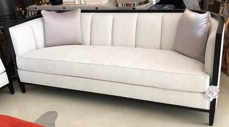 SEURAT SOFA Brand: Christopher Guy Product Code: CG-60-0408 The simplicity of this sophisticated demi-lune settee with channelled back and stepped legs draws inspiration from the simplicity of design