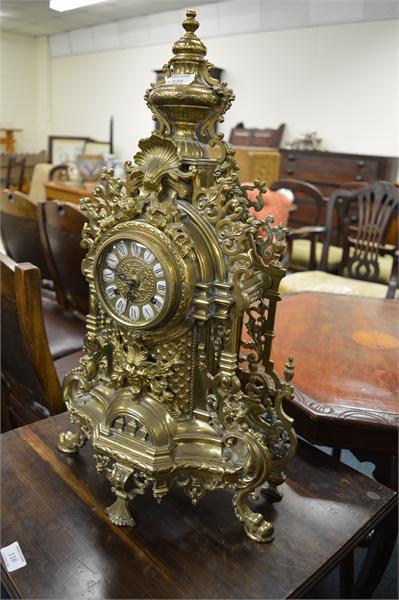 121 A large brass clock.