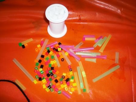 Here we show cut up drinking straws, plastic storebought beads.