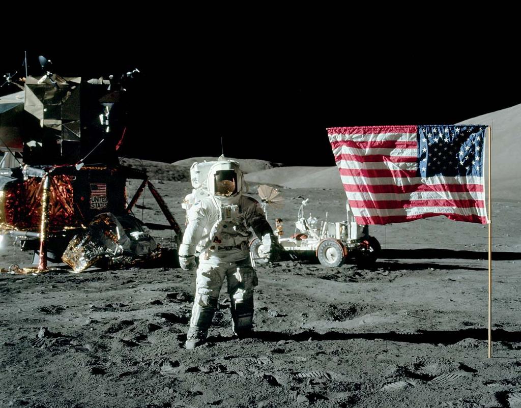 Apollo 17 Astronaut Harrison Jack Schmitt stands near the U.S. flag during NASA s final lunar landing mission in the Apollo series in 1972.